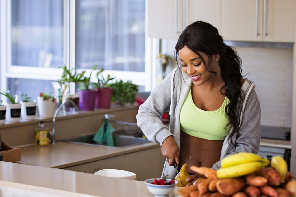 Fitness girl preparing healthy meal